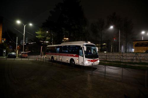 epa12609457 A Mining Emergency Service bus stands outside the Pniowek coal mine operated by Jastrzebska Coal Company in Pawlowice, southern Poland, 22 December 2025. A rescue operation is underway after contact was lost with two miners following a methane related incident at a depth of 830 metres; eight of the ten miners working at the site were safely...