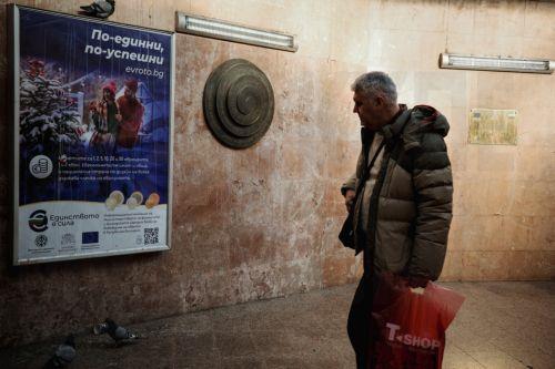 epa12616787 A man passes a euro adoption poster in Sofia, Bulgaria, 29 December 2025. Bulgaria is set to become the 21st member of the eurozone on 01 January 2026, transitioning from the national lev to the euro amid public concerns that the move could trigger immediate price hikes and a higher cost of living.  EPA/BORISLAV TROSHEV