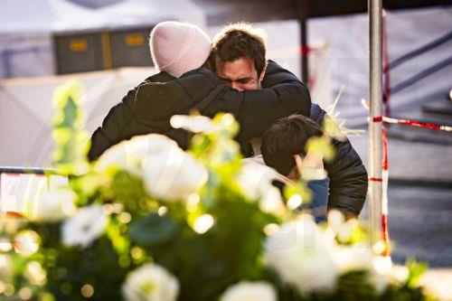 epaselect epa12620977 People console one another near the Le Constellation bar and lounge where a fire broke out following an explosion in the early hours of New Year's Eve, in Crans-Montana, Switzerland, 01 January 2026. According to the police, several dozen people lost their lives in the fire and around one hundred people were also reported injured. ...