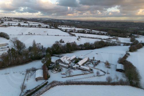 epa12621422 An aerial photograph taken with a drone shows snow on the hills of North Wales in Mold, Britain, 02 January 2026. Areas of Scotland, Wales, and England are under yellow and amber Met Office weather warnings for snow and ice, as cold arctic air from Scandinavia moves across the UK.  EPA/ADAM VAUGHAN