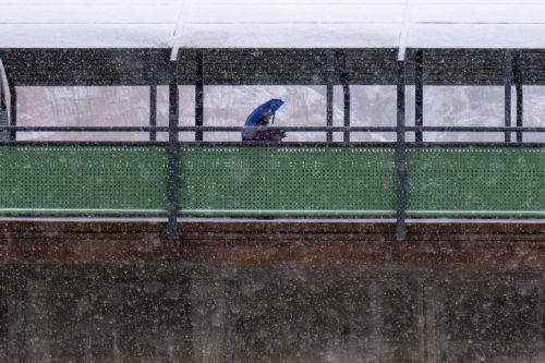epa12628326 A person holding an umbrella walks amid snow in Teruel, central Spain, 05 January 2026, due to Storm Francis.  EPA/ANTONIO GARCIA
