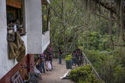 epa12632536 Government workers clean debris from a house damaged by the US attack in Caracas, Venezuela, 06 January 2026. Broken glass, bullet holes, dust, and paint remnants cover furniture and floors in several homes in a Caracas neighborhood affected by the US attack last 03 January, which culminated in the capture of President Nicolas Maduro and his...