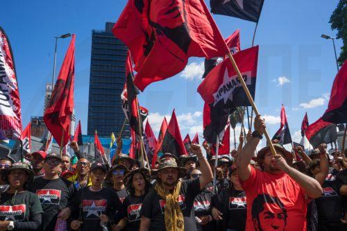 epa12639421 People wave flags during a demonstration in Caracas, Venezuela, 09 January 2026. Supporters of Venezuelan President Nicolas Maduro called for his release after he and his wife, Cilia Flores, were captured by US forces during a military operation on 03 January 2026. Maduro and Flores are being held in the United States on drug trafficking and...