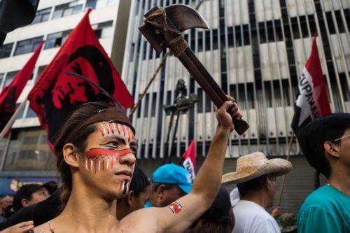 epa12639422 A person holds an axe during a demonstration in Caracas, Venezuela, 09 January 2026. Supporters of Venezuelan President Nicolas Maduro called for his release after he and his wife, Cilia Flores, were captured by US forces during a military operation on 03 January 2026. Maduro and Flores are being held in the United States on drug trafficking and...