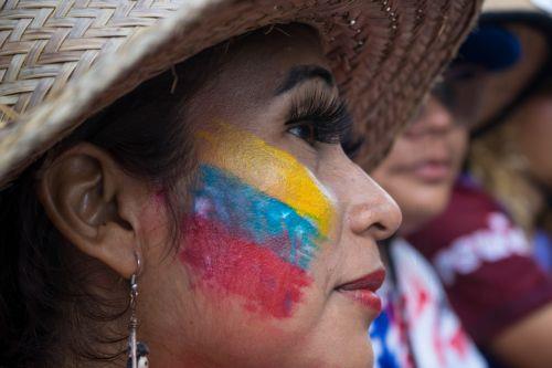 epa12639427 A person looks on during a demonstration in Caracas, Venezuela, 09 January 2026. Supporters Venezuelan President Nicolas Maduro called for his release after he and his wife, Cilia Flores, were captured by US forces during a military operation on 03 January 2026. Maduro and Flores are being held in the United States on drug trafficking and other...