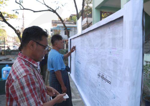 epa12639793 People check the voters list at a polling station, one day ahead of the second phase of election in Yangon, Myanmar, 10 January 2026. Myanmar's military government, known as the State Administration Council (SAC), plans to hold its first national vote since the February 2021 coup in a multi-stage general election, with the first phase held on 28...