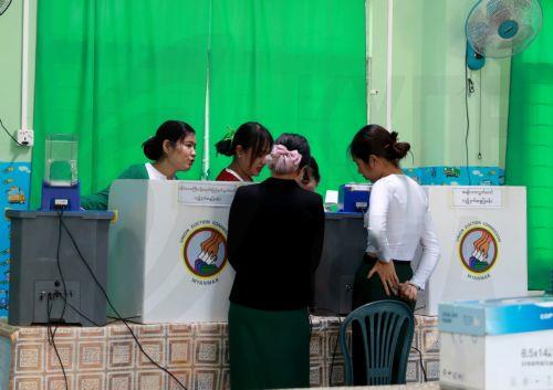 epa12639798 Volunteers of the Union Election Commission (UEC) set up an electronic voting machine at a polling station, one day ahead of the second phase of election in Yangon, Myanmar, 10 January 2026. Myanmar's military government, known as the State Administration Council (SAC), plans to hold its first national vote since the February 2021 coup in a...