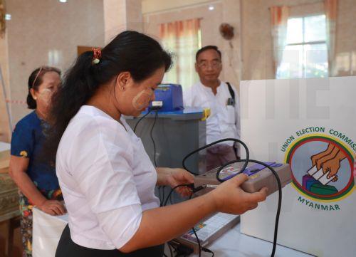 epa12639801 Volunteers of the Union Election Commission (UEC) set up an electronic voting machine at a polling station, one day ahead of the second phase of election in Yangon, Myanmar, 10 January 2026. Myanmar's military government, known as the State Administration Council (SAC), plans to hold its first national vote since the February 2021 coup in a...