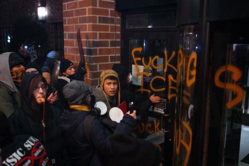 epa12647878 People bang on the windows of a hotel thought to house federal immigration enforcement agents during an anti-ICE protest in Minneapolis, Minnesota, USA, 13 January 2026. As part of a federal immigration crackdown involving over 2,000 agents from Border Patrol, Immigration and Customs Enforcement (ICE), and Homeland Security Investigations (HSI),...
