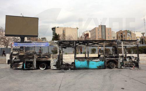 epa12650618 The wreckage of a burnt-out public bus in Tehran, Iran, 15 January 2026. The country remains under a near-total nationwide internet blackout that began on 08 January, amid an intensifying wave of anti-government protests.  EPA/ABEDIN TAHERKENAREH