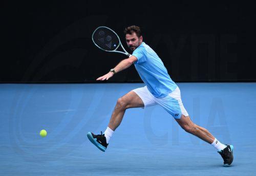 epa12660352 Stan Warwrinka of Switzerland in action against Laslo Djere of Serbia during their men’s first round match on day 2 of the 2026 Australian Open tennis tournament at Melbourne Park in Melbourne, Australia, 19 January 2026.  EPA/JOEL CARRETT AUSTRALIA AND NEW ZEALAND OUT