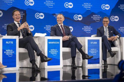 epa12666918 Secretary-General, North Atlantic Treaty Organization (NATO) Mark Rutte (L), President of Poland Karol Nawrocki (C), and President of Finland Alexander Stubb (R) speak during a panel discussion during the 56th annual meeting of the World Economic Forum (WEF) in Davos, Switzerland, 21 January 2026. The meeting under the topic 'A Spirit of...