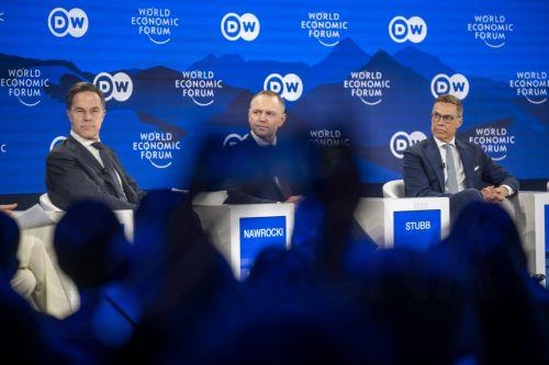 epa12666919 Secretary-General, North Atlantic Treaty Organization (NATO) Mark Rutte (L), President of Poland Karol Nawrocki (C), and President of Finland Alexander Stubb (R) speak during a panel discussion during the 56th annual meeting of the World Economic Forum (WEF) in Davos, Switzerland, 21 January 2026. The meeting under the topic 'A Spirit of...