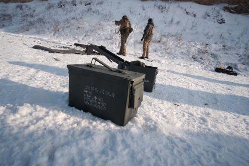 epa12675626 Infantry soldiers of the 13th Khartia Brigade of the National Guard of Ukraine take part in a military exercise at a training range in Kharkiv region, Ukraine, 23 January 2026. Extreme cold in Ukraine can lead to hypothermia for soldiers in trenches, affect how gunpowder performs, and slow reactions and dexterity, making training in these...