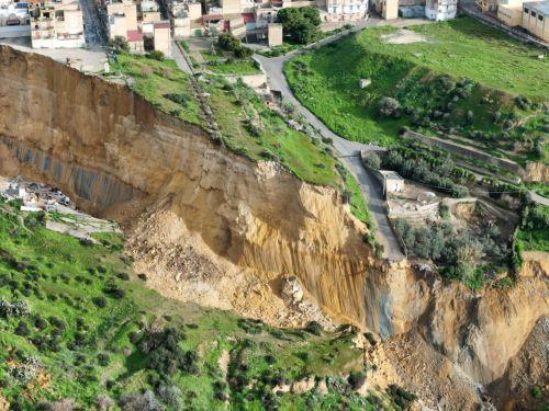 epa12682664 An aerial view taken with a drone shows the site of a landslide at Niscemi, Caltanissetta province, Sicily Island, southern Italy, 26 January 2026. Following days of heavy rainfall brought by a low-pressure system named 'Cyclone Harry,' a landslide forced the emergency evacuation of the Santa Croci, Trappeto, and Via Popolo neighborhoods....