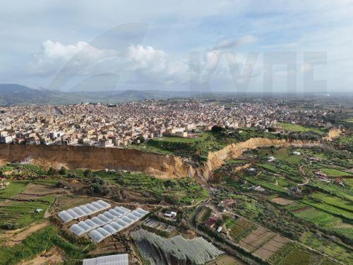epa12682666 An aerial view taken with a drone shows the site of a landslide at Niscemi, Caltanissetta province, Sicily Island, southern Italy, 26 January 2026. Following days of heavy rainfall brought by a low-pressure system named 'Cyclone Harry,' a landslide forced the emergency evacuation of the Santa Croci, Trappeto, and Via Popolo neighborhoods....