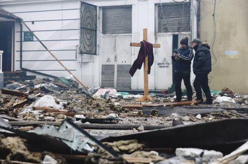 epa12685100 Local people inspect the damage at the site of a Russian strike on a residential area in Odesa, southwestern Ukraine, 27 January 2026, amid the Russian invasion. At least two people were killed and 24 others injured after an overnight Russian attack on Odesa, according to the State Emergency Service of Ukraine.  EPA/STRINGER