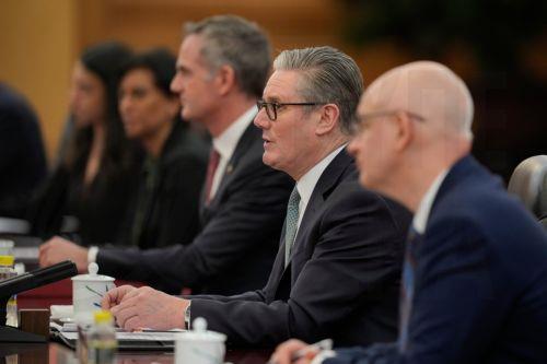 epa12689655 British Prime Minister Keir Starmer (2-R), speaks during a meeting with Chinese President Xi Jinping (unseen) at the Great Hall of the People in Beijing, China, 29 January 2026.  EPA/Vincent Thian / POOL