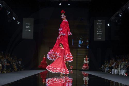 epa12690211 A model takes to the catwalk with some creations by Huelva's region designers under the motto 'Flamenco by Nature' during the International Flamenco Fashion Week held in Seville, Spain, on 29 January 2026.  EPA/Raul Caro
