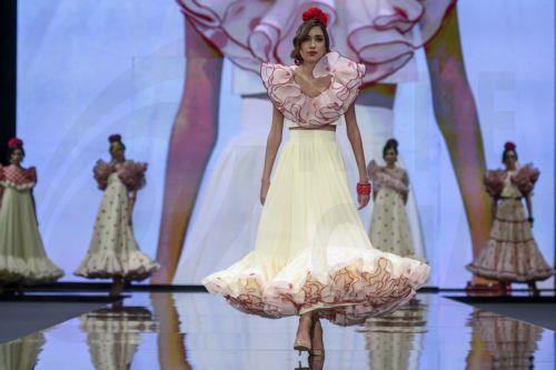 epa12690214 A model takes to the catwalk with some creations by Huelva's region designers under the motto 'Flamenco by Nature' during the International Flamenco Fashion Week held in Seville, Spain, on 29 January 2026.  EPA/Raul Caro