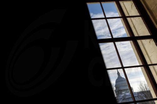 epa12691599 The US Capitol is seen through a window in Washington, DC, USA, 29 January 2026.  EPA/WILL OLIVER
