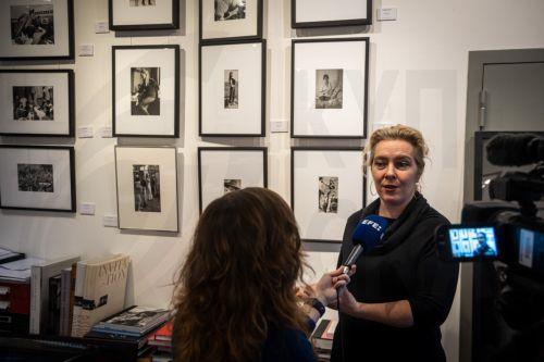 epa12692482 Julia Gragnon, daughter of the former photographer for Paris Match magazine Francois Gragnon and director of the Galerie de l'Instant, speaks to the media in front of photographic prints of French actress Brigitte Bardot exhibited for 'Et Dieu Crea Bardot' (And God created Bardot) in Paris, France, 30 January 2026.  EPA/CHRISTOPHE PETIT TESSON