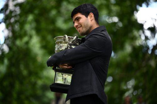 epa12699227 Carlos Alcaraz of Spain poses for a photograph with the Norman Brookes Challenge Cup after winning the Australian Open 2026 men’s singles final against Novak Djokovic of Serbia at the Royal Exhibition Building in Melbourne, Australia, 02 February 2026.  EPA/JOEL CARRETT AUSTRALIA AND NEW ZEALAND OUT