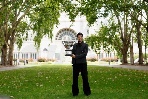 epa12699234 Carlos Alcaraz poses for a photograph after winning the AO 2026 men’s singles final against Novak Djokovic at the Royal Exhibition Building in Melbourne, Australia, 02 February 2026.  EPA/ROB PREZIOSO AUSTRALIA AND NEW ZEALAND OUT
