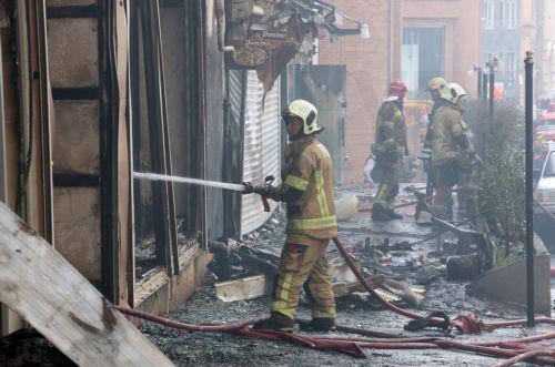 epa12701679 Firefighters try to control the fire at the Jannat shopping market in western Tehran, Iran, 03 February 2026. The cause of the fire is unclear.  EPA/ABEDIN TAHERKENAREH