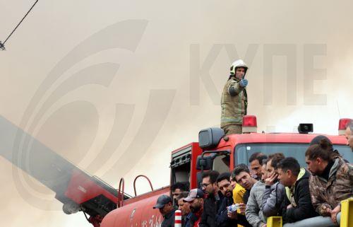 epa12701681 Firefighters try to control the fire at the Jannat shopping market in western Tehran, Iran, 03 February 2026. The cause of the fire is unclear.  EPA/ABEDIN TAHERKENAREH