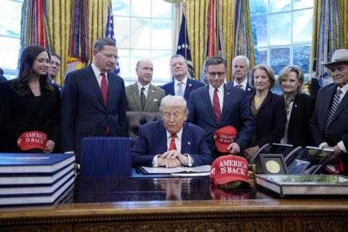 epa12703462 US President Donald Trump (C) participates alongside House Speaker Mike Johnson (C-R) in a bill signing ceremony in the Oval Office of the White House in Washington, DC, USA, 03 February 2026. The bill passed by the House of Representatives restores funding for several major federal departments, ending the partial government shutdown that began...