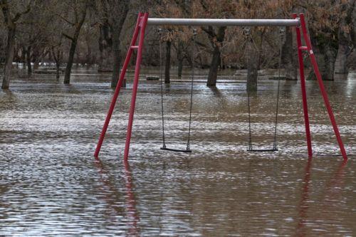 epaselect epa12708552 A flooded playground after Adaja river overflow in Avila, central Spain, 06 February 2026. Almost all Spain is on alert for heavy rainfalls and wind storms.  EPA/RAUL SANCHIDRIAN