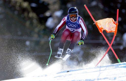 epa12711815 James Crawford of Canada competes in the Men's Downhill of the Alpine Skiing competition, at the Milano Cortina 2026 Winter Olympic Games, Stelvio ski centre in Bormio, Italy, 07 February 2026.  EPA/GUILLAUME HORCAJUELO