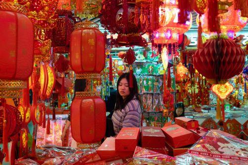 epa12719312 A person browses decorations on sale amid preparations for the Chinese New Year in Beijing, China, 09 February 2026. The Chinese New Year, or Spring Festival, begins on 17 February, ushering in the Year of the Fire Horse with festivities running until the Lantern Festival on 03 March.  EPA/JESSICA LEE