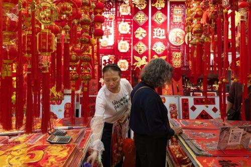 epa12719316 People browse decorations on sale amid preparations for the Chinese New Year in Beijing, China, 09 February 2026. The Chinese New Year, or Spring Festival, begins on 17 February, ushering in the Year of the Fire Horse with festivities running until the Lantern Festival on 03 March.  EPA/JESSICA LEE