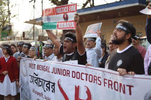 epa12719654 Doctors and citizens gather during a protest campaign against violence and rape targeting women in Kolkata, India, 09 February 2026. A trainee doctor was found dead on 09 August 2024 in a seminar room of the RG Kar Medical College in Kolkata, sparking nationwide protests and strikes by medical students and doctors. In January 2025, the main...