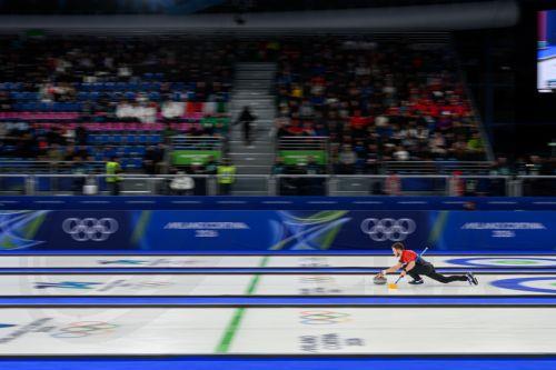 epa12719760 Korey Dropkin of the United States competes in the Mixed Doubles match between USA and Italy of the Curling competition, at the Milano Cortina 2026 Winter Olympic Games in Cortina d'Ampezzo, Italy, 09 February 2026.  EPA/JURE MAKOVEC
