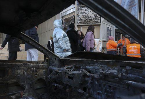 epa12719864 Ukrainian people and communal workers inspect the damage at the site of a Russian strike in Odesa, southwestern Ukraine, 09 February 2026, amid the Russian invasion. At least one person was killed and two others injured after a drone hit a residential area, damaging a high-rise building and a gas pipeline, according to the State Emergency...
