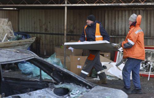 epa12719867 Communal workers remove debris from the site of a Russian strike in Odesa, southwestern Ukraine, 09 February 2026, amid the Russian invasion. At least one person was killed and two others injured after a drone hit a residential area, damaging a high-rise building and a gas pipeline, according to the State Emergency Service of Ukraine.  EPA/IGOR...