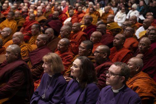 epa12725421 Monks and members of the interfaith community come together at the Washington National Cathedral during the Walk For Peace in Washington, DC, USA, 10 February 2026. The Theravada Buddhist monks, who have walked from  Fort Worth, Texas, will make stops at the National Cathedral and Embassy Row before walking to the US Capitol and holding a peace...