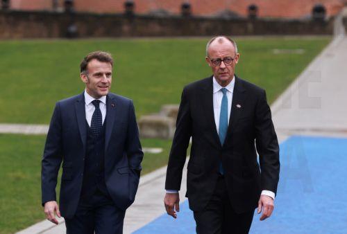 epa12730226 France's president Emmanuel Macron (L) and Germany's Chancellor Friedrich Merz arrive to attend the Informal EU leaders' retreat at Alden Biesen Castle in Bilzen, Belgium, 12 February 2026. The strategic session focuses on deepening the Single Market, boosting investment, and enhancing Europe's competitiveness in a shifting geoeconomic...