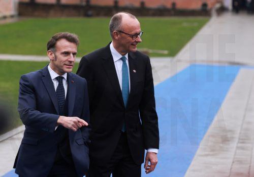epa12730229 France's president Emmanuel Macron (L) and Germany's Chancellor Friedrich Merz arrive to attend the Informal EU leaders' retreat at Alden Biesen Castle in Bilzen, Belgium, 12 February 2026. The strategic session focuses on deepening the Single Market, boosting investment, and enhancing Europe's competitiveness in a shifting geoeconomic...