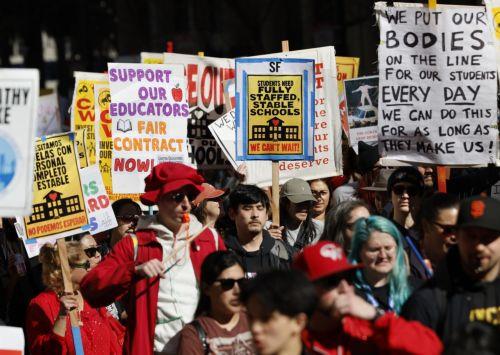 epa12732998 San Francisco teachers, educators and supporters rally and march as the teachers' strike enters its fourth day in San Francisco, California, USA, 12 February 2026. The San Francisco Unified School District (SFUSD) and union representatives continue negotiating a new contract as schools remain closed. The last San Francisco teachers' strike was...