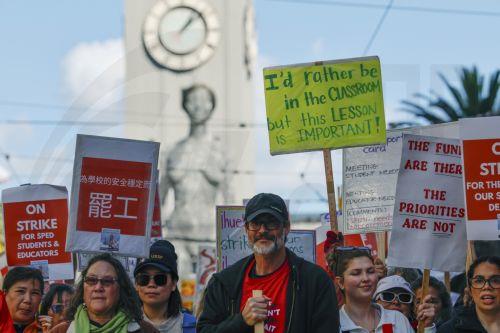 epa12733002 San Francisco teachers, educators and supporters rally and march as the teachers' strike enters its fourth day in San Francisco, California, USA, 12 February 2026. The San Francisco Unified School District (SFUSD) and union representatives continue negotiating a new contract as schools remain closed. The last San Francisco teachers' strike was...