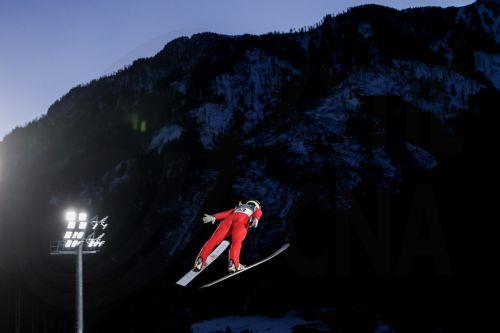 epa12745157 Sina Arnet of Switzerland in action during the trial round of the Women's Large Hill of the Ski Jumping competitions at the Milano Cortina 2026 Winter Olympic Games, in Predazzo, Italy, 15 February 2026.  EPA/FILIP SINGER