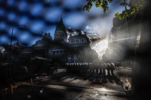 epa12760166 Members of the Argentine Police stand in formation during clashes with protesters at a demonstration against labor reform proposed by Argentine President Javier Milei in Buenos Aires, Argentina, 19 February 2026.  EPA/JUAN IGNACIO RONCORONI