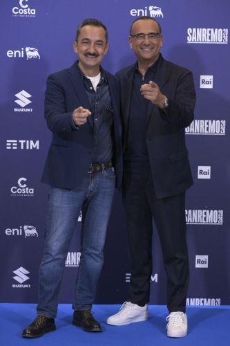 epa12773128 Sanremo Festival host and artistic director Carlo Conti (R) and Italian TV presenter Nicola Savino (L) pose during a photocall at the 76th edition of the Sanremo Italian Song Festival in Sanremo, Italy, 24 February 2026. The music festival will run from 24 to 28 February 2026.  EPA/RICCARDO ANTIMIANI