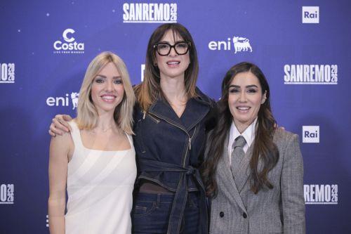 epa12773140 (L-R) TV presenters Carolina Rey, Ema Stokholma, and Manola Moslehi pose during a photocall at the 76th edition of the Sanremo Italian Song Festival in Sanremo, Italy, 24 February 2026. The music festival will run from 24 to 28 February 2026.  EPA/RICCARDO ANTIMIANI
