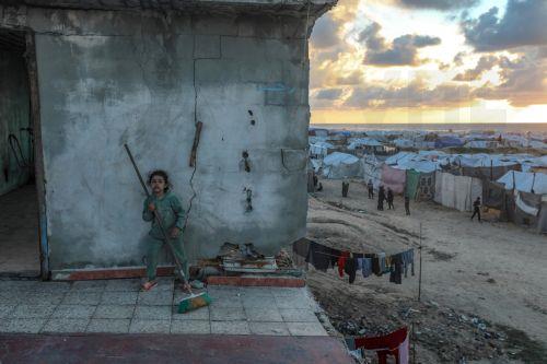 epaselect epa12774705 A displaced Palestinian girl plays outside her family's shelter, located in the remains of a destroyed building among makeshift tents during the holy month of Ramadan, near the beach in Gaza City, 24 February 2026. Muslims around the world celebrate the holy month of Ramadan by praying during the nighttime and abstaining from eating,...