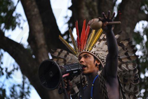 epa12774765 An Indigenous person celebrates after the Brazilian government repeals Decree 12600 in front of the Planalto Palace in Brasilia, Brazil, 24 February 2026. The decree had authorized concessions for the construction of three waterways in the Amazon and sparked protests from indigenous groups concerned about the effects of river dredging on their...
